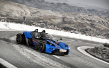 Синий KTM X-Bow GT, горы, занос, вираж, поворот