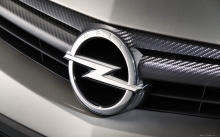 Значок Opel на решетке радиатора, логотип, карбон, блеск
